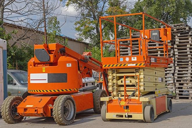 industrial forklift lifting heavy loads in a warehouse in Kiln